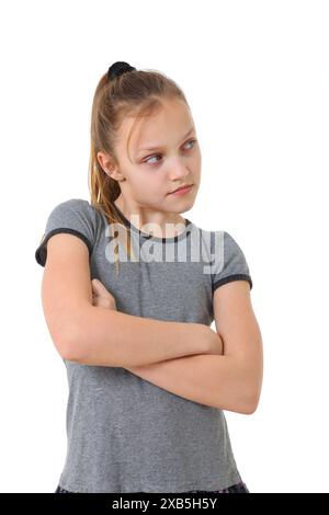 annoyed teenage girl looking sideway to copy space on white background Stock Photo