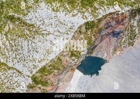 Dead Volcano Rim Dead trees, crater rim of chaiten volcano, colored rock, small lake ...