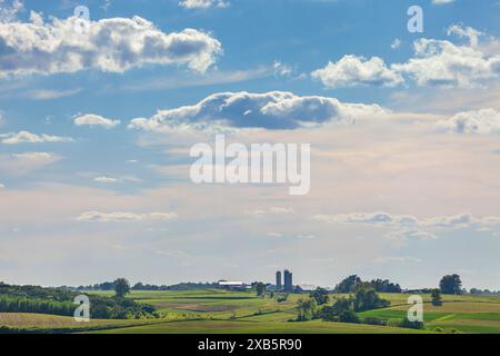 Iowa farm and fields under a beautiful cloudscape on a sunny summer afternoon Stock Photo