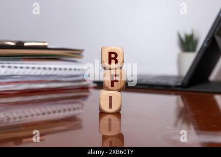 three stone cubes inscribed with the word RFI Request for information Stock Photo