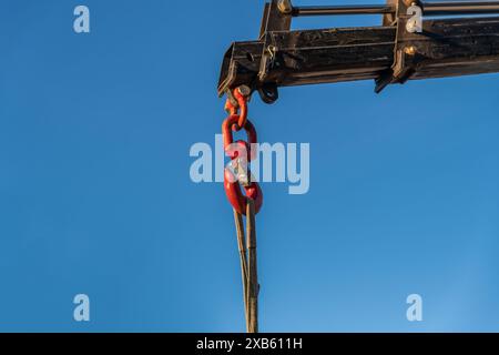 close-up of crane hook lifting load Stock Photo