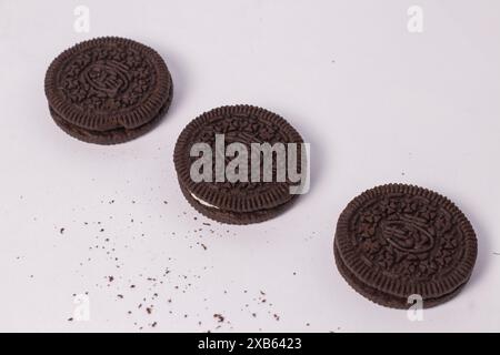 Crispy chocolate biscuits with vanilla cream inside, children's favorite fast food snack Stock Photo