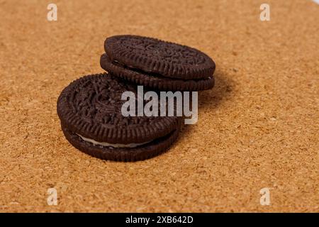 Crispy chocolate biscuits with vanilla cream inside, children's favorite fast food snack Stock Photo