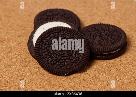 Crispy chocolate biscuits with vanilla cream inside, children's favorite fast food snack Stock Photo