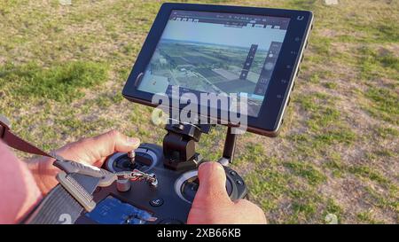San Rafael, Argentina, november 6, 2020:Drone remote control in hand man.Man operating of flying drone Stock Photo