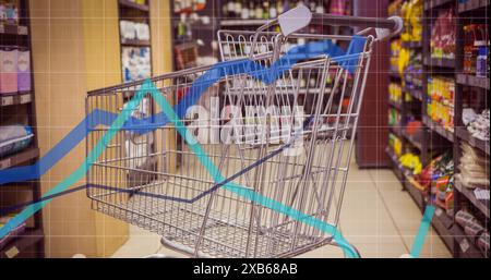 Empty shopping cart in grocery store aisle with graph overlay Stock Photo