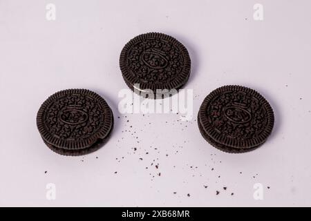Crispy chocolate biscuits with vanilla cream inside, children's favorite fast food snack Stock Photo