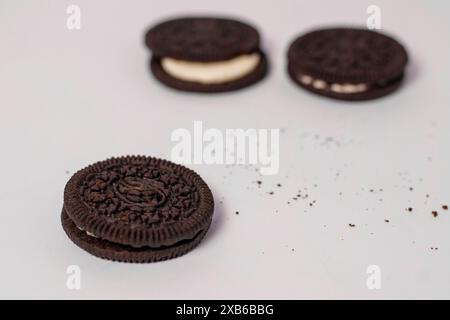 Crispy chocolate biscuits with vanilla cream inside, children's favorite fast food snack Stock Photo
