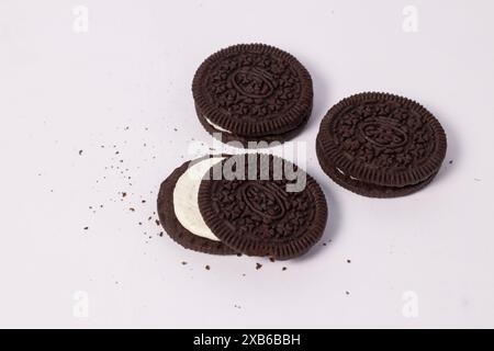 Crispy chocolate biscuits with vanilla cream inside, children's favorite fast food snack Stock Photo