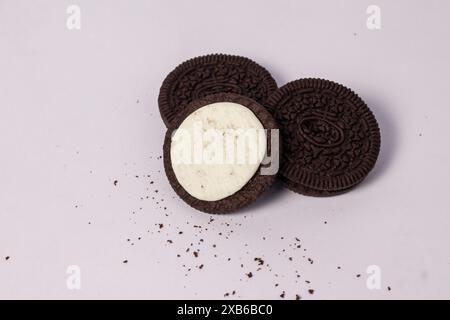 Crispy chocolate biscuits with vanilla cream inside, children's favorite fast food snack Stock Photo