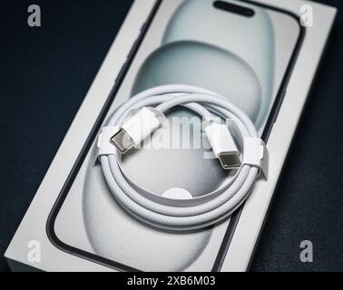 A new braided USB-C cable on top of the new Apple iPhone 15 box. Stock Photo