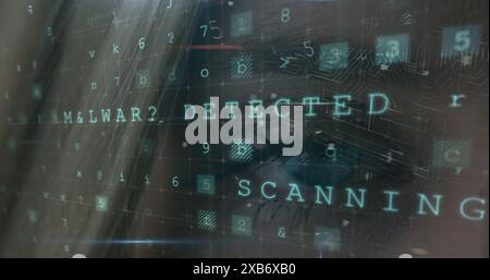 Young Caucasian female looking at computer screen with malware detection message Stock Photo