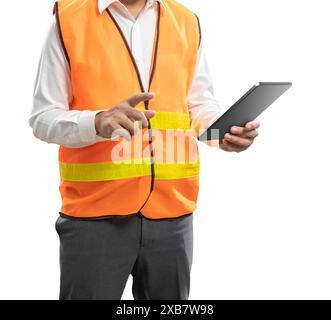 Asian engineer or technician hand holding digital tablet wear safety helmet and reflective vest Stock Photo