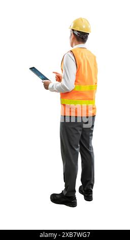 Asian engineer or technician full body length hand holding digital tablet wear safety helmet and reflective vest isolated on white Stock Photo
