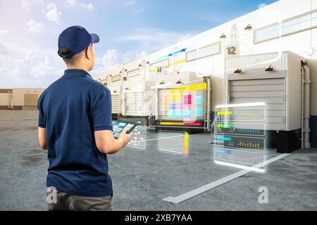 Asian worker or engineer work at warehouse with digital tablet Stock Photo