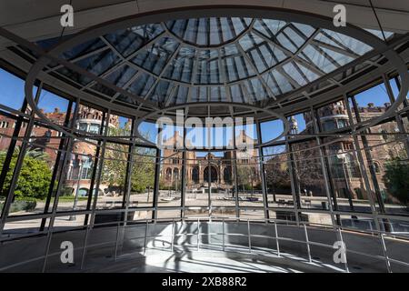 Interior of a dome with tall windows, surrounded by buildings Stock Photo