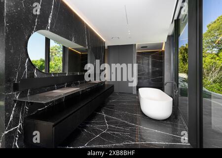 A bathroom featuring a bathtub and vanity Stock Photo