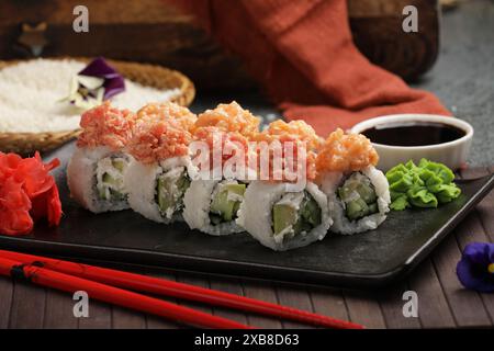 A shot of vegetable sushi roll with assorted veggies and a side of dipping sauce Stock Photo