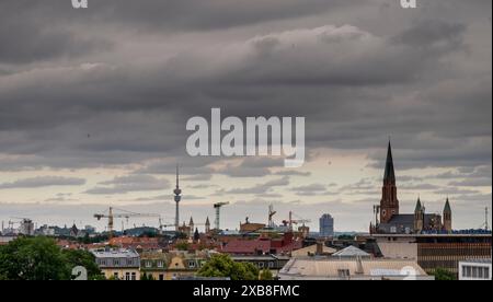 Munich, Germany. 11th June, 2024. Clouds hang over the skyline of the Bavarian capital in the morning. Credit: Peter Kneffel/dpa/Alamy Live News Stock Photo