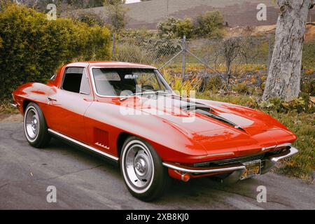 A 1966 Chevy red car with black stripes, with a powerful V8 427 big block engine Stock Photo