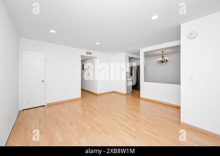 Empty room with white walls and light wooden floors Stock Photo