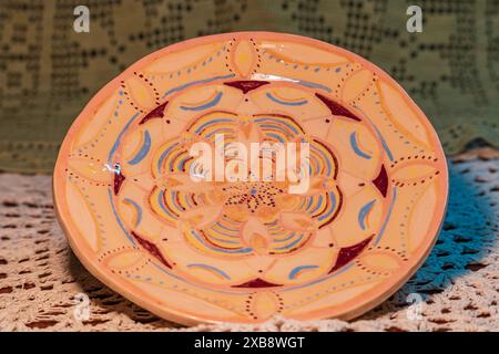 Hand-painted ceramic plate with floral mandala design Stock Photo