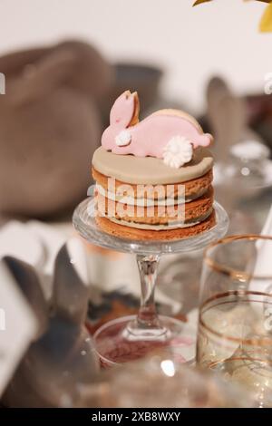 A vertical shot of an Easter bunny cookie pastry in pink color Stock Photo