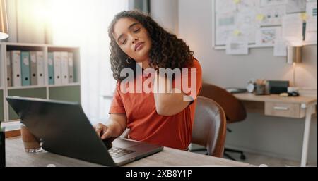 Burnout, laptop and problem solving with designer woman in creative workplace for project management. Computer, headache and stress with unhappy Stock Photo