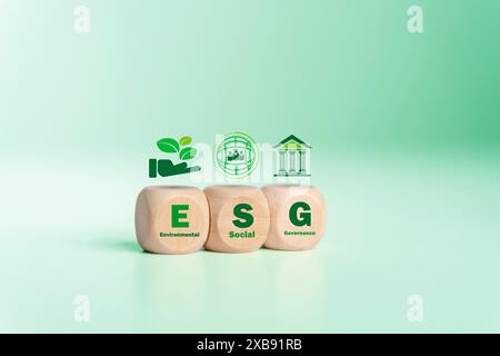 ESG concept regarding environment, social, and governance. Green esg icon symbol on wooden block. Investing in sustainable green businesses Environmen Stock Photo