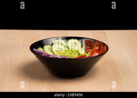 The various fresh vegetables in a bowl on rustic wooden table Stock Photo