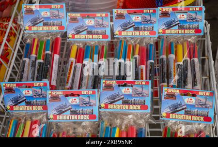 Sticks of traditional multi-coloured Brighton rock candy for sale at a tourist shop on the south coast at Brighton, Eat Sussex, UK Stock Photo