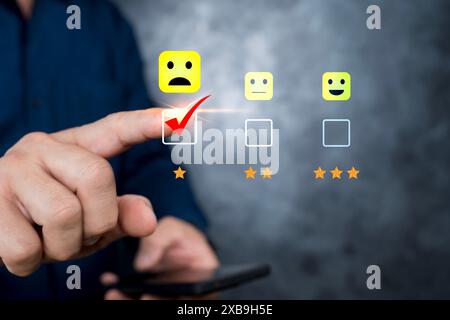 Customer Experience dissatisfied Concept, Unhappy man customer giving sadness emotion face on online survey, Bad review, bad service dislike bad quali Stock Photo