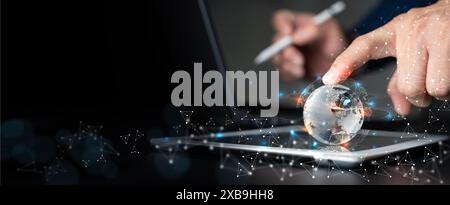 Internet network technology, digital software development, future tech background, IoT concept. Man using digital tablet and laptop with global networ Stock Photo