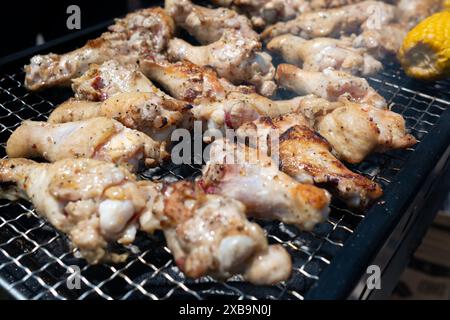 Chicken legs on the barbecue grill Stock Photo