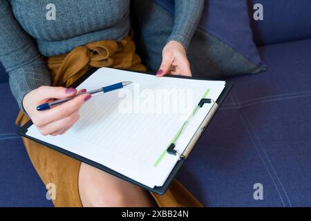 Notepad for writing in the female hands of the doctor. Psychotherapy social problems addiction concept Stock Photo