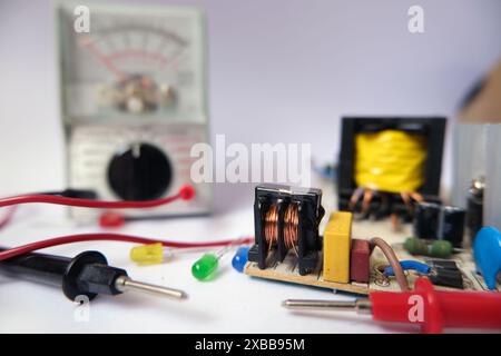 Electronic works bench. Testing or repairing in technical department. Focused on inductance. Stock Photo