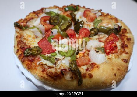 Delicious dominos pizza named Veg Extravaganza pizza with topping of ...