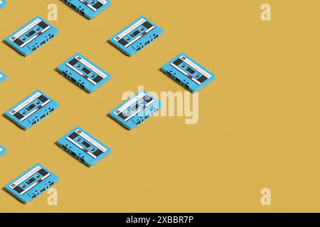 Isometric pattern of blue cassettes on yellow background. 3d illustration. Stock Photo