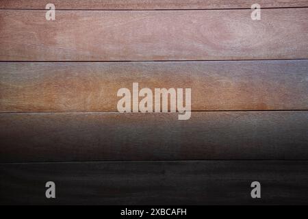 Wooden planks with a gradient from light brown at the top to dark brown at the bottom, creating a rustic feel, background image Stock Photo