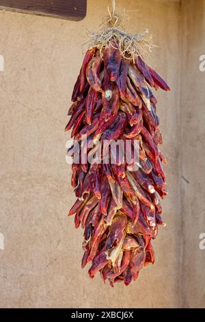 Hanging chile ristra string of dried red chili peppers Stock Photo