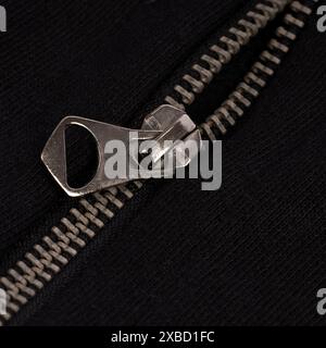 Close-Up of Silver Zipper on Black Fabric Stock Photo
