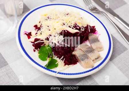 Beetroot served with cheese and pickled mackerel Stock Photo