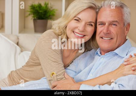 Attractive Healthy Senior Man Woman Couple at Home Smiling Stock Photo