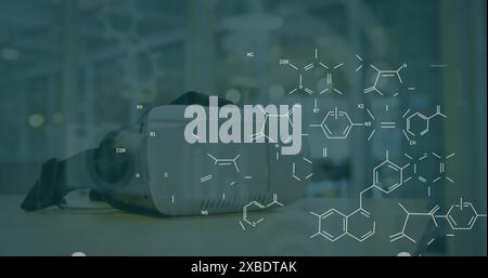 Image of chemical formulas over vr headset Stock Photo
