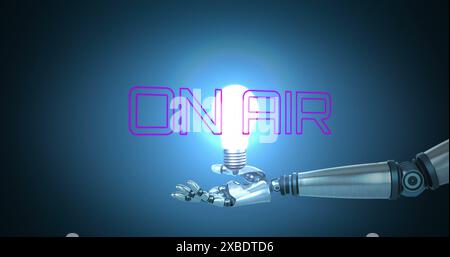 Image of on air text over robotic hand holding light bulb on black background Stock Photo