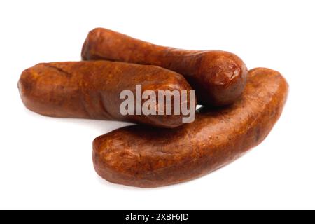 pile of red smoked beef sausage isolated on a white background Stock Photo