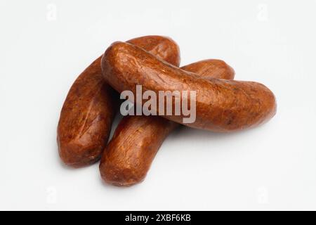 pile of red smoked beef sausage isolated on a white background Stock Photo