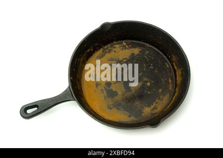 Rusty iron cast skillet, isolated on white background, close up shot Stock Photo
