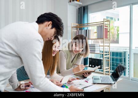 Creative Team collaboration on UX UI Design Project in Modern Office Environment with Digital Devices and Design Tools Stock Photo