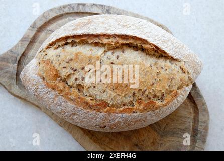 sourdough bread on wooden cutting board Stock Photo